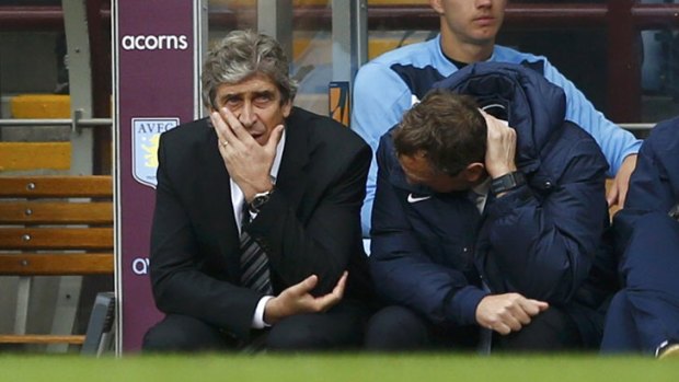 Not happy: Manchester City's manager Manuel Pellegrini (L) watches on as his side loses to Aston Villa at Villa Park in Birmingham.