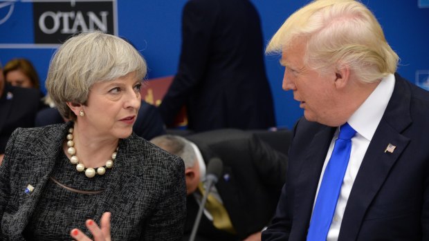 US President Donald Trump, right, speaks with British Prime Minister Theresa May.