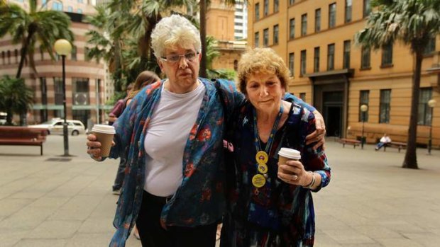 Eyvette Parr comforts survivor of abuse Trish Charter (right), who was at St Joseph's Orphanage in Goulburn, outside the Royal Commission.