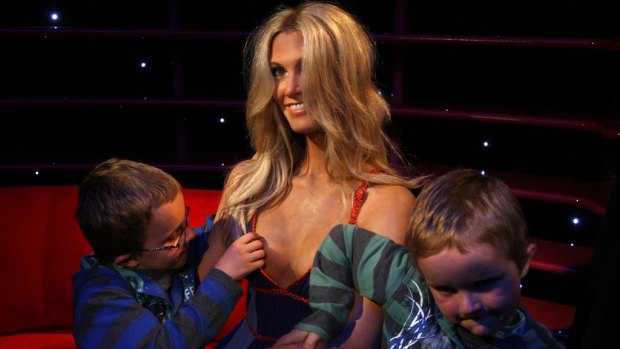 Two young boys examine the finer detail of Delta Goodram's doppleganger  at Madame Tussauds in Sydney.
