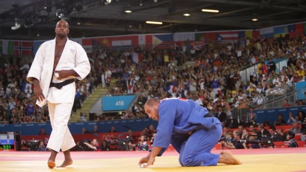 Master class &#8230; France's judoka Teddy Riner walks the walk after dispatching Tunisia's Faicel Jaballah on his way to gold in the 100kg-plus division.