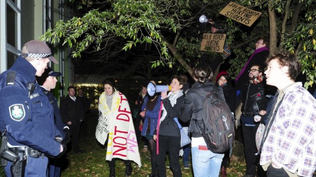ACT Policing at ANU's University House block protesters as they gather
while Julie Bishop addresses a Crawford Australian Leadership Forum.