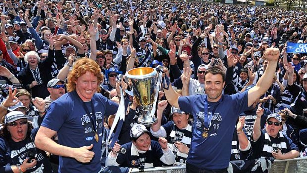 Great day: Geelong fans showed no signs they are tired of premiership celebrations when thousands turned out at Kardinia Park yesterday to see the cup and their heroes led by captain Cameron Ling and coach Chris Scott.