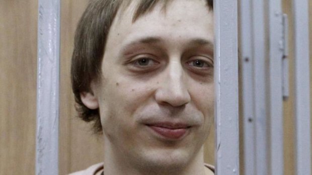 Former Bolshoi Theatre dancer Pavel Dmitrichenko inside the defendant's cage during his court hearing.