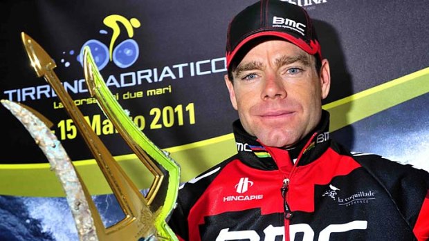 Looking sharp . . . Cadel Evans poses with the trident trophy after his overall victory in the Tirreno-Adriatico race in Italy.
