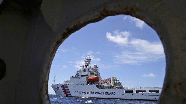 A Chinese Coast Guard ship attempts to block a Philippine government vessel as the latter tries to enter Second Thomas Shoal in the South China Sea in March 2014  to relieve Philippine troops and resupply provisions.