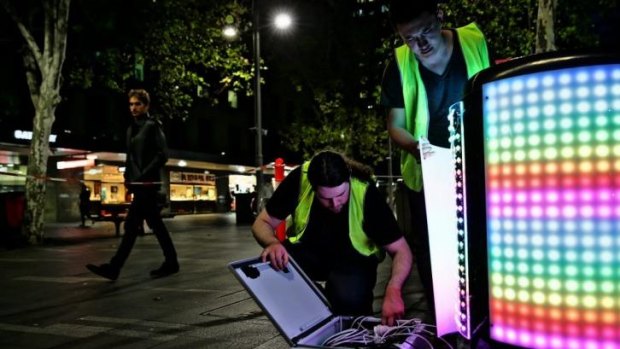 Sam Johnson (left) and Steven Bai (right) install their Tetrabin ahead of the launch of Vivid LIGHTS.