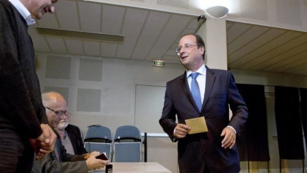 French President Francois Hollande casts his vote at a polling station in Tulle, central France.