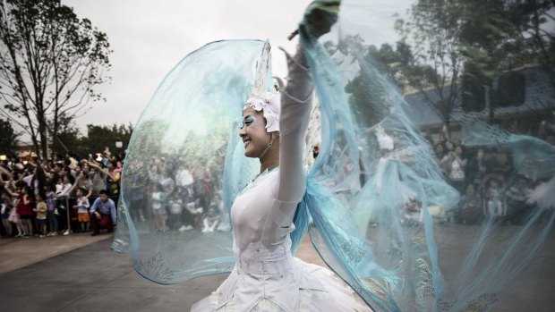 A dancer performs in a parade at Walt Disney's Shanghai Disneyland.