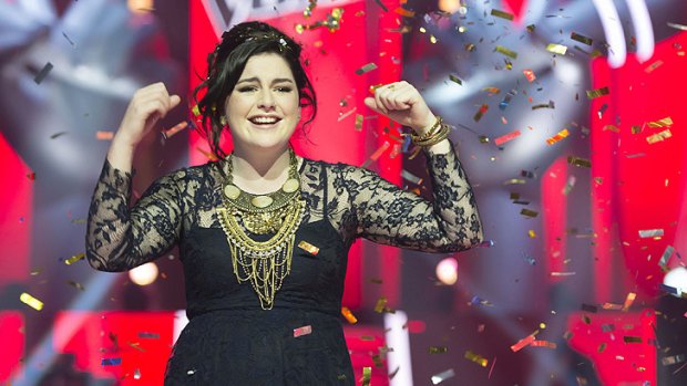 A triumphant Karise Eden celebrates after winning the inaugural season of <i>The Voice</i>.