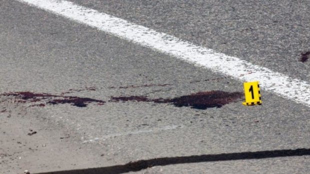 Assassination attempt ... A Ukrainian police sign marks traces of blood at the place where Kharkiv mayor Gennady Kernes was shot.