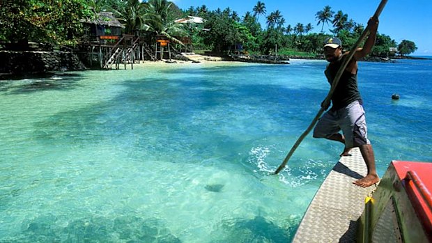 A local navigates the Samoan waters.