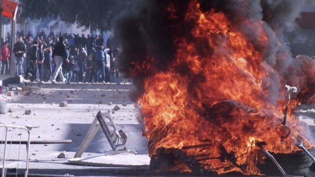 Protesters set fire to tyres during clashes with police in Kasserine on January 8.