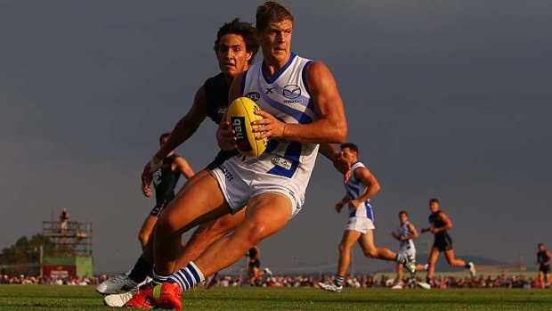 New Roo Nick Dal Santo looks to find space against Carlton.