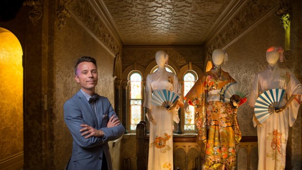 Drew Grove, state commercial manager of The National Trust of Australia, with some of The Dressmaker costumes at Rippon Lea House.