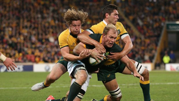 Unlucky: Michael Hooper, left, was demoted from the Wallabies' starting XV despite a strong showing against South Africa.