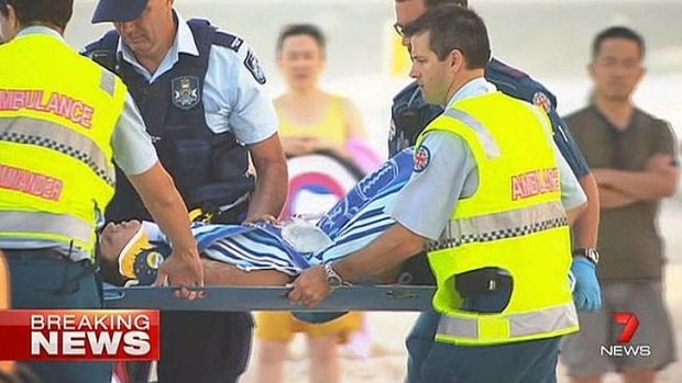 A man is taken to hospital after being hit by a 4WD on the beach at Surfers Paradise.