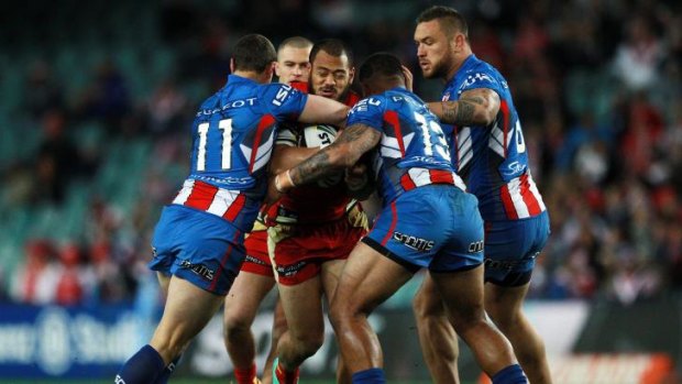 Hungry defence: The Roosters converge on Dragons forward Leeson Ah Mau.
