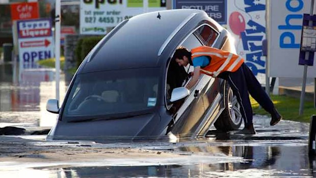 Giant potholes and huge pools of liquefaction appeared on suburban streets.