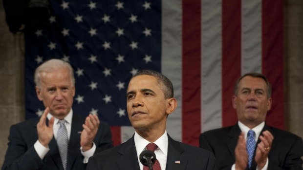 Mr Obama delivers his State of the Union address, watched by Vice-President Joe Biden (left) and Speaker John Boehner.