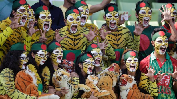 Bangladeshi spectators cheer their team during the second Test between Bangladesh and England in Dhaka. 