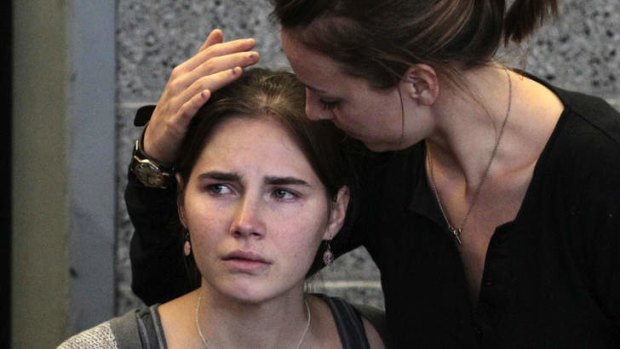 Amanda Knox is comforted by her sister, Deanna, after arriving home in Seattle following her release from prison in October 2011.