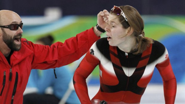 Australian-born Canadian Christine Nesbitt reacts after learning that she won the women's 1000m speed skating event.