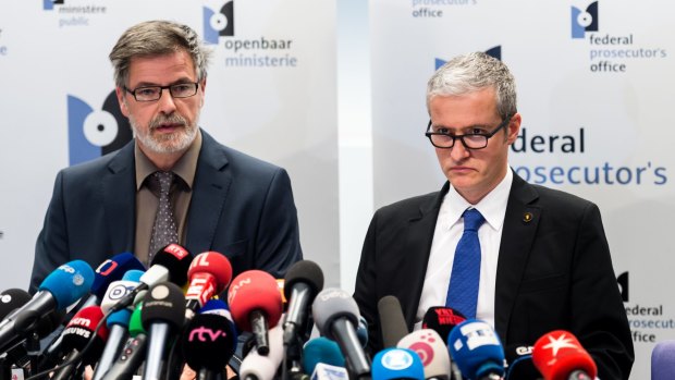 Over 13 raids in Belgium ... Belgian federal magistrates Eric Van Der Sypt, left, and Thierry Werts address the media on the anti-terrorism raids in several Belgian cities.