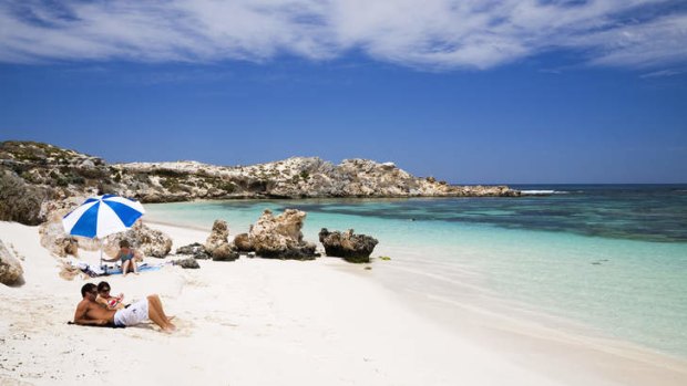 Sunbathers on beach at Salmon Bay. Rottnest island, WA.