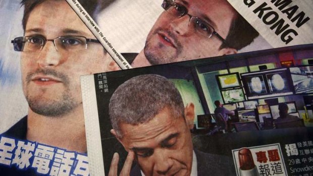 Front page: Photos of Edward Snowden and Barack Obama appear in Hong Kong newspapers.