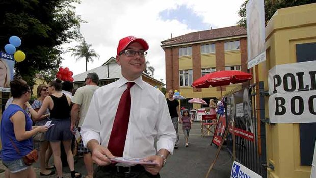 Labor MP Andrew Fraser handing out how to vote cards at Milton State School, Milton.