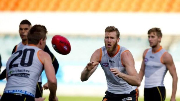 "We play footy on a weekend and if we lose, the sun still comes up the next day, but for these guys they're carrying guys and got their lives in their hands": Giants player Jon GIles.