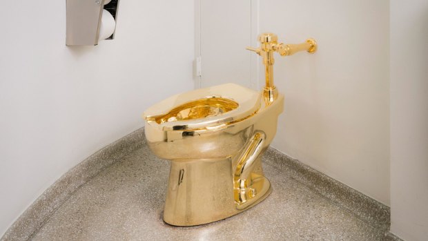 The18-karat gold toilet is shown in the museum's 14th floor restroom.