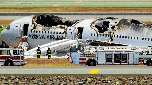 An Asiana Airlines Boeing 777 is seen on the runway at San Francisco International Airport after crash landing.