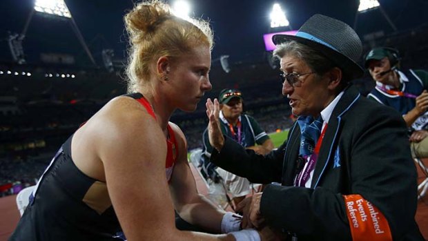 Confusion ... Germany's Betty Heidler listens to a referee explaining the events.