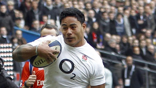Opening score ... Manu Tuilagi scores a try in the corner despite the tackle of Aurelien Rougerie.