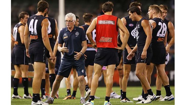 Blues coach Mick Malthouse gives instructions to Levi Casboult during a break in the game at Etihad Stadium.