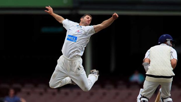 Jumping Kat &#8230; NSW's Simon Katich leaps for a catch off his own bowling to Victoria at the SCG yesterday.