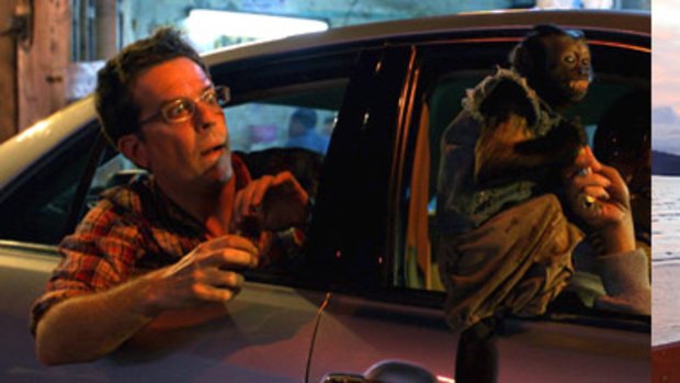 Above left: The Hangover Part II’s Ed Helms in the car chase scene; (right)  Scott McLean, the stuntman for Helms.