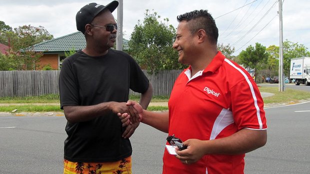 Indigenous community leader Paul Butterworth shakes the hand of Samoan Wesleyan Methodist Church pastor Moe Fonoti.