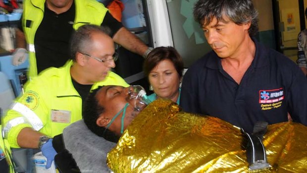 Survived catastrophe: A man is brought into Civico hospital in Sicilian capital Palermo, after being rescued from the wreckage of a migrant boat that capsized. Hundreds are feared drowned.