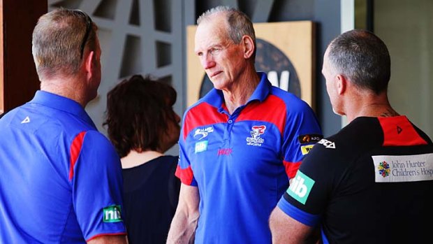 Newcastle Knights coach Wayne Bennett talks to coaching staff. He has been linked with moves to North Queensland and Brisbane. <i>Photo: Ryan Osland</i>