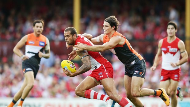 SYDNEY, NEW SOUTH WALES - APRIL 09:  Lance Franklin of the Swans is tackled by Phil Davis of the Giants during the round three AFL match between the Sydney Swans and the Greater Western Sydney Giants at Sydney Cricket Ground on April 9, 2016 in Sydney, Australia.  (Photo by Matt King/AFL Media/Getty Images)