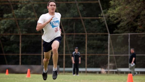 All fired up ... Mark Milligan in training Sydney as he fights to get back into the Socceroos squad.