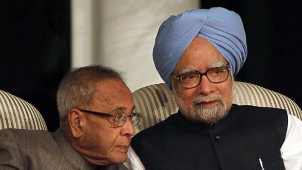Prime Minister Manmohan Singh (right) confers with his finance minister.