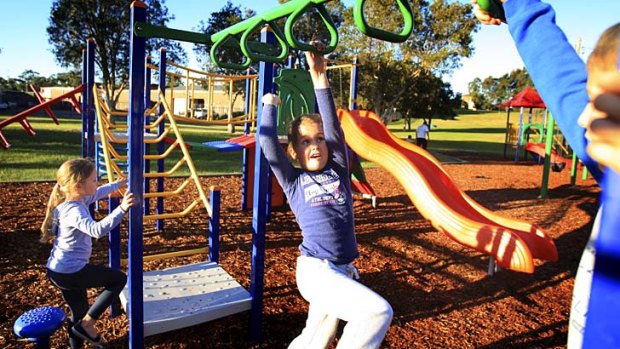 At risk: Children play in a park adjacent to Grace Campbell Circuit at Hillsdale, where toxic metals and chemicals were discovered.