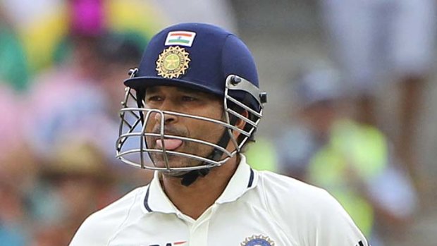 Weighed down: Indian batsman Sachin Tendulkar leaves the SCG arena yesterday after falling 20 runs short of scoring his 100th international century.