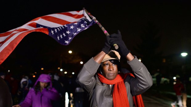 Demonstrators march in Ferguson, Missouri, against the grand jury ruling on the Michael Brown case.