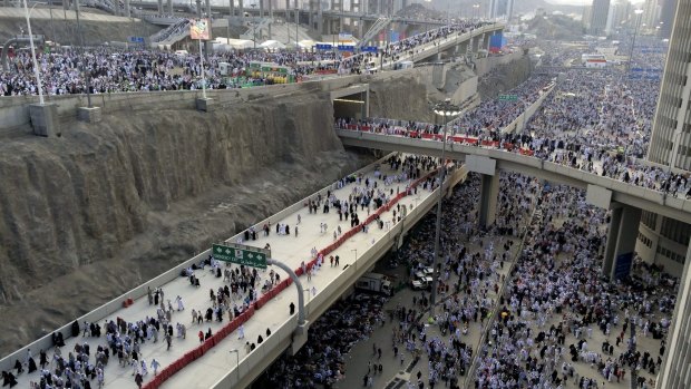 Thousands of Muslim pilgrims make their way to throw stones at a pillar, symbolising the stoning of Satan, during the annual pilgrimage.