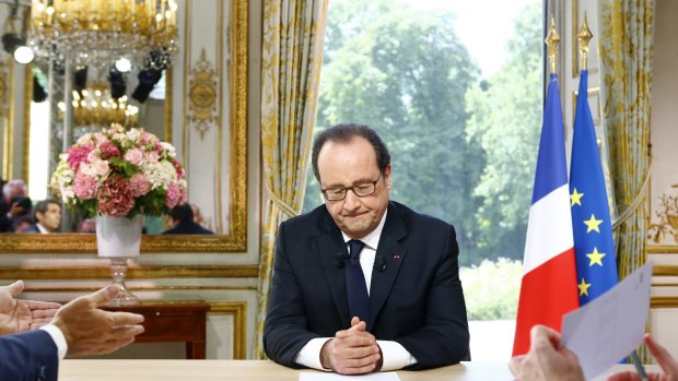 French President Francois Hollande closes his eyes after a televised interview following the Bastille Day Parade in Paris, Thursday, July 14, 2016. (AP Photo/Francois Mori, Pool)